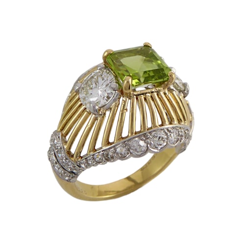 Peridot, diamond and gold open work bombe ring, mounted by Cartier,